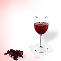 Berry punch in a red wine glass.