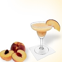 Frozen Peach Margarita served in a margarita glass with a piece of peach and a sugar or salt rim.