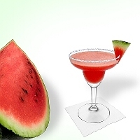 Frozen Watermelon Margarita served in a margarita glass with watermelon decoration and sugar or salt rim.
