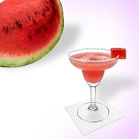 Watermelon Margarita served in a margarita glass with watermelons and sugar or salt rim.